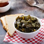 Cooked collard greens in a foam bowl, southern barbeque side